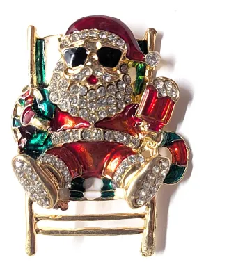 **NEW ARRIVAL** Jeweled "SANTA in a BEACH CHAIR" BROOCH (1¾" x 1½") Wearing Sunglasses, Santa Outfit and Gold Colored...