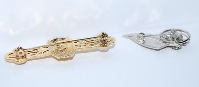 Collection of 2 BROOCHES - Gold Colored LION BAR (2" x¾") and Silver Colored Flower & Leaf (1¼" x 1")