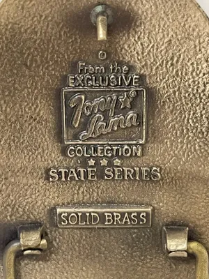 Sale Photo Thumbnail #155: Vintage Tony Lama Great Seal of the State of Oklahoma solid brass belt buckle from the State Series, featuring Oklahoma’s official state seal with the 1907 statehood date and detailed Western imagery throughout.