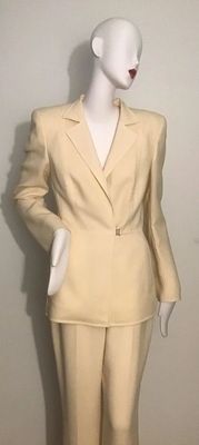 Vintage AKRIS cream-colored light wool women's pantsuit, featuring a structured blazer with a single metal clasp closure and...