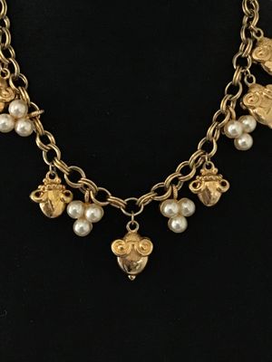 Sale Photo Thumbnail #32: A vintage gold-tone chain necklace by Kenneth Jay Lane (marked © KJL on hangtag). Features a double link chain adorned with detailed acorn-shaped drop charms and faux pearl clusters. Includes an adjustable extender chain with a pearl end drop. Overall go