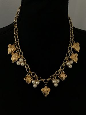 Sale Photo Thumbnail #31: A vintage gold-tone chain necklace by Kenneth Jay Lane (marked © KJL on hangtag). Features a double link chain adorned with detailed acorn-shaped drop charms and faux pearl clusters. Includes an adjustable extender chain with a pearl end drop. Overall go
