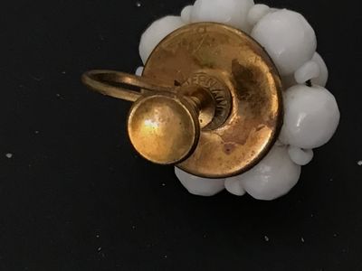 Sale Photo Thumbnail #106: Pair of vintage mid-century cluster screw-back earrings featuring opaque white glass beads on gold-tone metal backings. Stamped 'WEST GERMANY' on the screw hardware. In good vintage condition with minor surface age appropriate wear to metal backs.