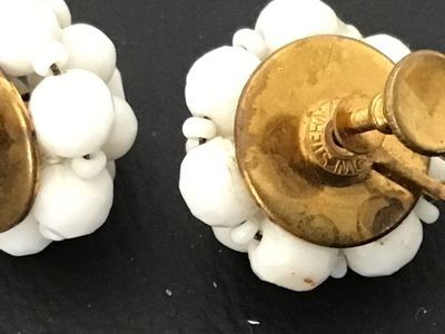 Sale Photo Thumbnail #102: Pair of vintage mid-century cluster screw-back earrings featuring opaque white glass beads on gold-tone metal backings. Stamped 'WEST GERMANY' on the screw hardware. In good vintage condition with minor surface age appropriate wear to metal backs.