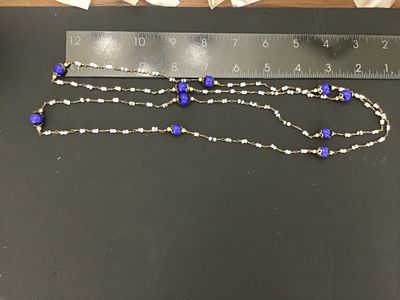 Sale Photo Thumbnail #14: Long vintage wire-wrapped beaded strand necklace featuring cobalt blue glass accent beads with filigree caps and white seed beads linked together with metal wire. Measures over 24 inches total length when doubled/extended as shown against the ruler. Showi