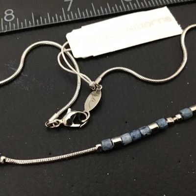 Sale Photo Thumbnail #45: New with tags Liz Claiborne silver-tone snake chain necklace featuring blue speckled stone or glass beads and silver-tone spacer accents. Measures approximately 16 inches in length with a lobster claw clasp and Liz Claiborne metal hang tag. Original retai