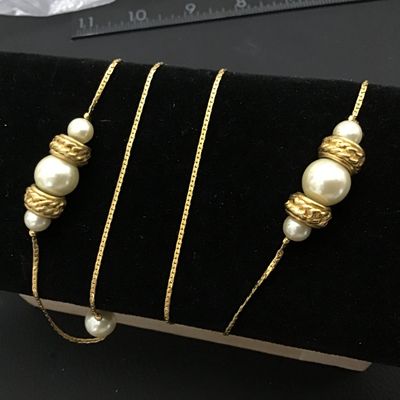 Sale Photo Thumbnail #63: Long vintage opera-length station necklace featuring a gold-tone snake chain interspersed with clusters of faux pearl beads and textured, gold-tone accent spacers. Good condition with light vintage wear. Perfect for layering or wearing single/double wrapp