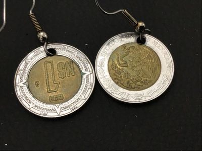 Sale Photo Thumbnail #111: Pair of drop wire earrings crafted from 1993 Mexican 1 Nuevo Peso (N$) bi-metallic coins featuring the Mexican coat of arms and Aztec calendar details. Metal french hook ear wires. Light wear and patina consistent with age and coin circulation.