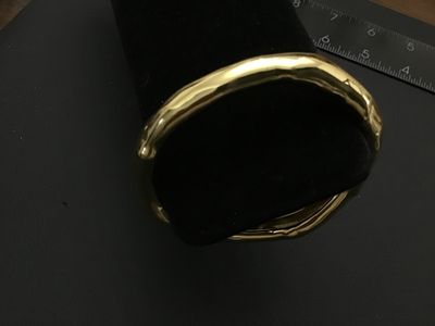 Sale Photo Thumbnail #155: Alexis Bittar gold-tone designer bangle bracelet featuring an organic, undulating sculptural design. Stamped with the Alexis Bittar maker's mark on the interior.   Excellent Condition