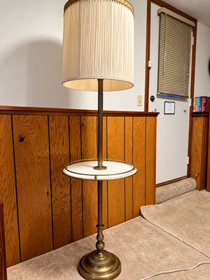 Sale Photo Thumbnail #16: Vintage brass floor lamp featuring an integrated round tray table and a tall pleated cream shade.