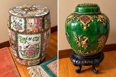 Sale Photo Thumbnail #21: Rose Medallion Chinese porcelain garden stool with raised gilt bosses alongside a green-glazed ginger jar featuring raised symbols on a carved wooden base.