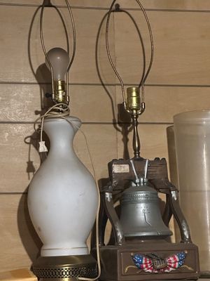 Sale Photo Thumbnail #246: Two vintage table lamps, including a frosted white glass urn-form lamp and a Bicentennial Liberty Bell novelty lamp.
