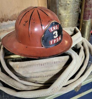Genuine fireman hat and hose