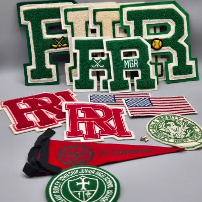 LOT 56L: Varsity Letters from Ridley High, Vintage East Stroudsburg State College Felt Pennant, and More