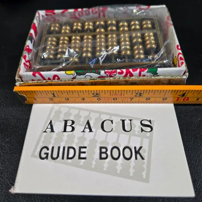 LOT 53L: Vintage Chinese Mini Brass Abacus, Bausch & Lomb "New Gem" Microscope, Drafting Tool Set, and Collection of Glass...