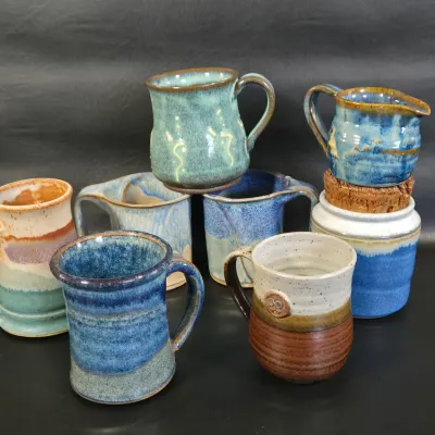 LOT 48L: Collection of Stoneware Mugs, Jar with Cork Lid, and Small Creamer Pitcher