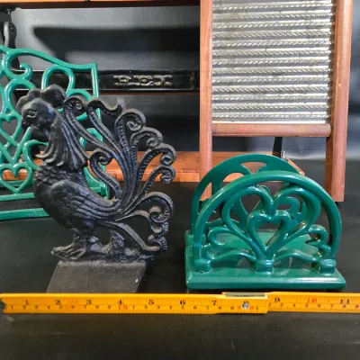 LOT 47K: Cast Iron Trivet, Cookbook Stand, Napkin Holder, Spool Holder, & Rooster Bookend, Dubl Handi Washboard, and General Store...