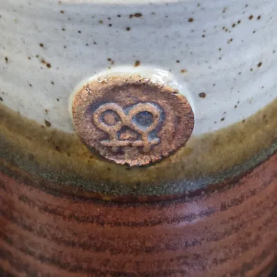 LOT 48L: Collection of Stoneware Mugs, Jar with Cork Lid, and Small Creamer Pitcher