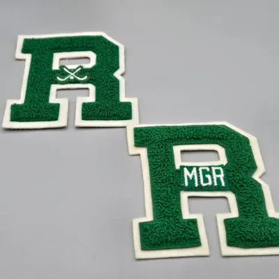 LOT 56L: Varsity Letters from Ridley High, Vintage East Stroudsburg State College Felt Pennant, and More