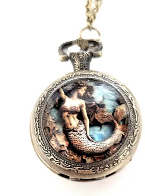 Sale Photo Thumbnail #84: Colorful Exotic MERMAID POCKET WATCH with Black Chain (30" L . Chain/Lobster Clasp) and Gold Tone Case & Setting**EXTRA BATTERY INCLUDED**

Dial: Analog
Opening: Top-Push Knob
ALL ITEMS SHIPPED FREE