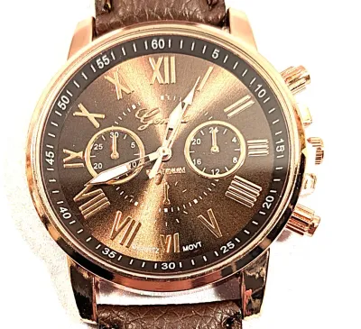 Sale Photo Thumbnail #206: BROWN Double Dials WATCH + Luminescent Hands-BAND: (Brown 9" Faux Leather) DIAL: (1½" Brown, Round, Rose Gold Edge) BRAND: (Geneva) BATTERY: Button 20 mm  *EXTRA BATTERY INCL.*
ALL ITEMS SHIPPED FREE