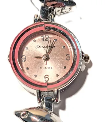 Sale Photo Thumbnail #36: Fun, Interesting DOLPHIN WATCH with Small Pink Surround Dial (¾" Diam.) and Metal Alloy Pink & Silver Colored Dolphins Band, Snap-Over Clasp on a Silver Tone STAINLESS STEEL Case Back**EXTRA BATTERY INCLUDED**

QUARTZ
Non-rechargeable Battery
Brand: ALPH