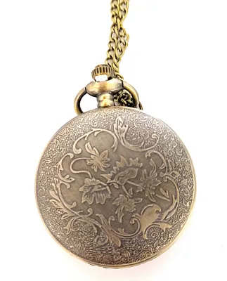 Sale Photo Thumbnail #100: Red, Blue on "Brass INDIAN-STYLE" POCKET WATCH with Brass Colored Case (1¾" Diam.) & BRASS Colored Chain (30" L . Chain/Lobster Clasp) **EXTRA BATTERY INCLUDED**

Dial: Analog 
Opening: Top-Push Knob
ALL ITEMS SHIPPED FREE