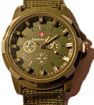 *KHAKI GREEN SPORTS" WATCH with BAND: (GREEN/Canvas 9") DIAL: (1½" Green, Acrylic Surround + ROUND) BRAND: (GEMIUS)...