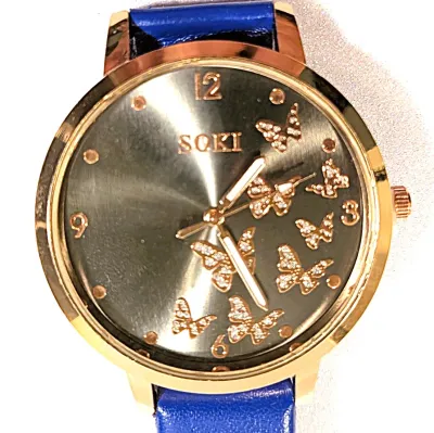 Sale Photo Thumbnail #101: "FLUTTERING BUTTERFLIES" WATCH + Luminescent Hands-BAND: (Dark Blue 9" Faux Leather) DIAL: (1½" Taupe, Round, Rose Gold Edge) BRAND: (Soki) BATTERY: Button 20 mm *EXTRA BATTERY INCL.*
ALL ITEMS SHIPPED FREE