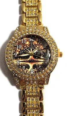Sale Photo Thumbnail #185: Gold Colored VERY JEWELED BAND + DIAL "Celestial Amber" WATCH with BAND: (Gold Tone, Clear Stones Segments 8") DIAL: (1¼" Gold Tone with Jeweled Surround + Round) BATTERY: Button 20 mm  *EXTRA BATTERY INCL.*
ALL ITEMS SHIPPED FREE