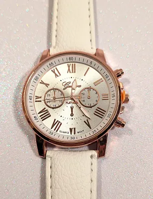 Sale Photo Thumbnail #109: WHITE Double Dials WATCH + Luminescent Hands-BAND: (White 9" Faux Leather) DIAL: (1½" White, Round, Rose Gold Edge) BRAND: (Geneva) BATTERY: Button 20 mm  *EXTRA BATTERY INCL.*
ALL ITEMS SHIPPED FREE