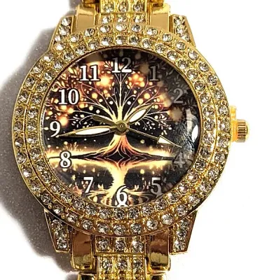 Sale Photo Thumbnail #186: Gold Colored VERY JEWELED BAND + DIAL "Celestial Amber" WATCH with BAND: (Gold Tone, Clear Stones Segments 8") DIAL: (1¼" Gold Tone with Jeweled Surround + Round) BATTERY: Button 20 mm  *EXTRA BATTERY INCL.*
ALL ITEMS SHIPPED FREE