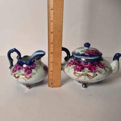 LOT 356K: Limoges Egg Trinket Box, Antique Reticulated Plate in Shadowbox Frame, Hand painted Tea Pot & Creamer