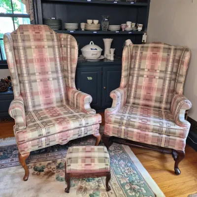 LOT 353L: Matching Upholstered His & Hers Highback Wing Chairs and Footstool