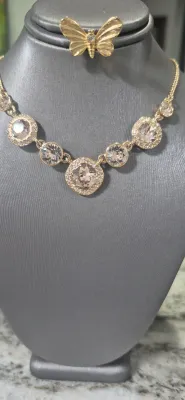 Givenchy clear stones in gold tone framework & Butterfly pin