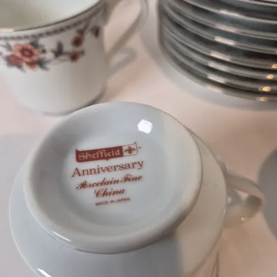 LOT 16L: Vintage Sheffield Anniversary Floral Pattern China-Service for 8-missing one cup