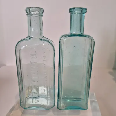 LOT 21D: Collection of Vintage Glass Bottles with Corn Cob Soap Dispenser