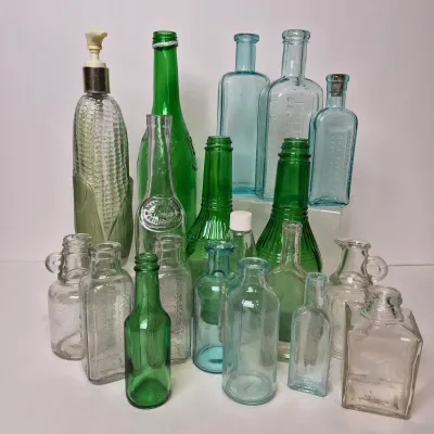 LOT 21D: Collection of Vintage Glass Bottles with Corn Cob Soap Dispenser