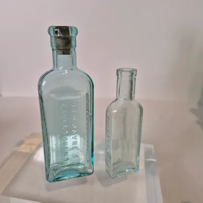 LOT 21D: Collection of Vintage Glass Bottles with Corn Cob Soap Dispenser