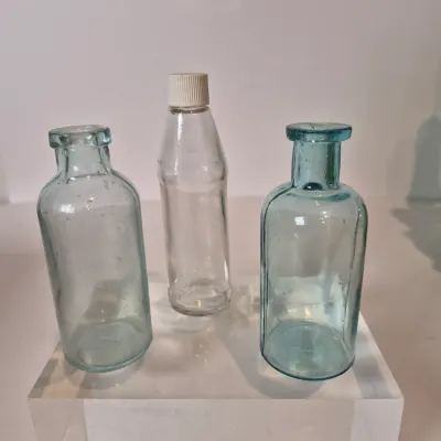 LOT 21D: Collection of Vintage Glass Bottles with Corn Cob Soap Dispenser