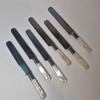 LOT 47L: Set of Antique Mother of Pearl Handled Knives with Sterling Silver Collars