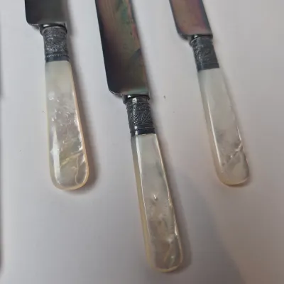 LOT 47L: Set of Antique Mother of Pearl Handled Knives with Sterling Silver Collars