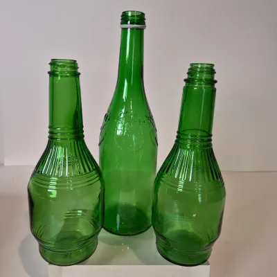 LOT 21D: Collection of Vintage Glass Bottles with Corn Cob Soap Dispenser