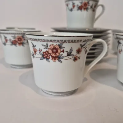 LOT 16L: Vintage Sheffield Anniversary Floral Pattern China-Service for 8-missing one cup