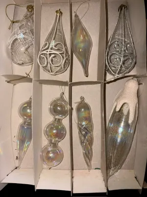 Sale Photo Thumbnail #59: Mixed Lot of Hand-Blown Glass Christmas Ornaments
Beautiful assortment of vintage and newer hand-blown glass Christmas ornaments featuring clear, glittered, swirled, hand-painted, and iridescent Aurora Borealis finishes in a variety of shapes and sizes. I