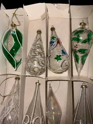 Sale Photo Thumbnail #57: Mixed Lot of Hand-Blown Glass Christmas Ornaments
Beautiful assortment of vintage and newer hand-blown glass Christmas ornaments featuring clear, glittered, swirled, hand-painted, and iridescent Aurora Borealis finishes in a variety of shapes and sizes. I