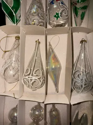 Sale Photo Thumbnail #58: Mixed Lot of Hand-Blown Glass Christmas Ornaments
Beautiful assortment of vintage and newer hand-blown glass Christmas ornaments featuring clear, glittered, swirled, hand-painted, and iridescent Aurora Borealis finishes in a variety of shapes and sizes. I