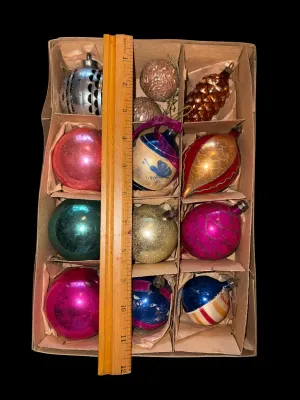 Sale Photo Thumbnail #105: A charming assortment of 13 vintage Christmas ornaments featuring both glass and plastic examples in a variety of classic holiday styles. Includes mercury glass ornaments, an indented reflector ornament, mosaic glass ornaments, a textured pinecone ornamen