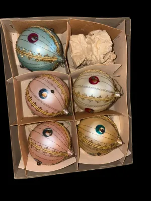 Sale Photo Thumbnail #90: Set of 5 Vintage West Germany Indent Glass Christmas Ornaments
Beautiful set of vintage West Germany glass Christmas ornaments featuring distinctive center indent reflectors, delicate crinkle wire wrapping, gold trim, and jewel-tone reflector accents. Sof