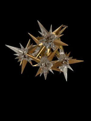 Sale Photo Thumbnail #111: Add elegant sparkle to your holiday décor with this lot of five Traditions AAF acrylic star snowflake ornaments. Each ornament features a dimensional clear acrylic starburst design accented with metallic gold points and ornate gold-tone cone caps with ha